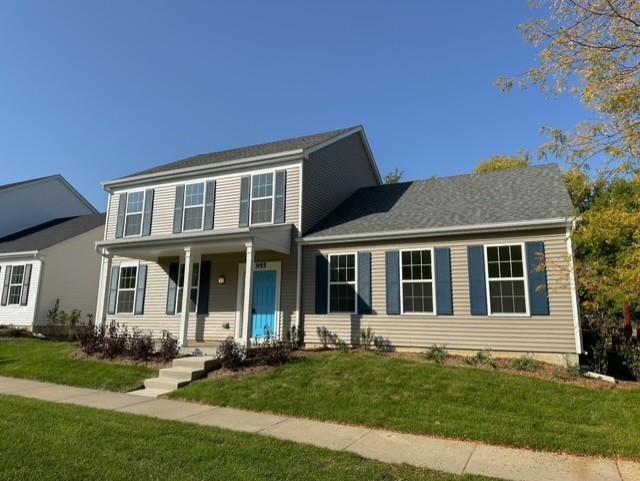 view of front of house featuring a front yard and covered porch