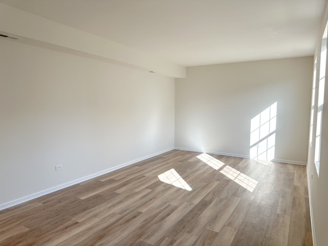 spare room with light hardwood / wood-style floors