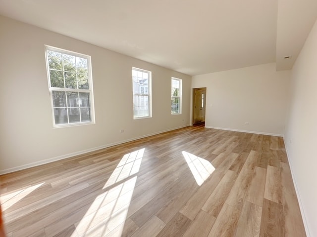 unfurnished room featuring light wood-type flooring