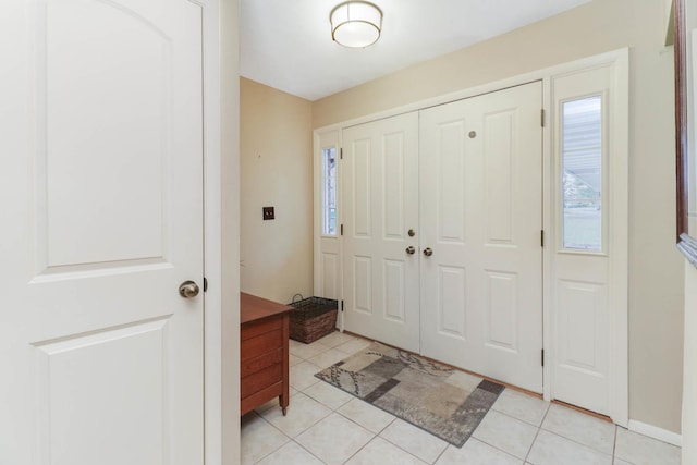 entryway with light tile patterned floors