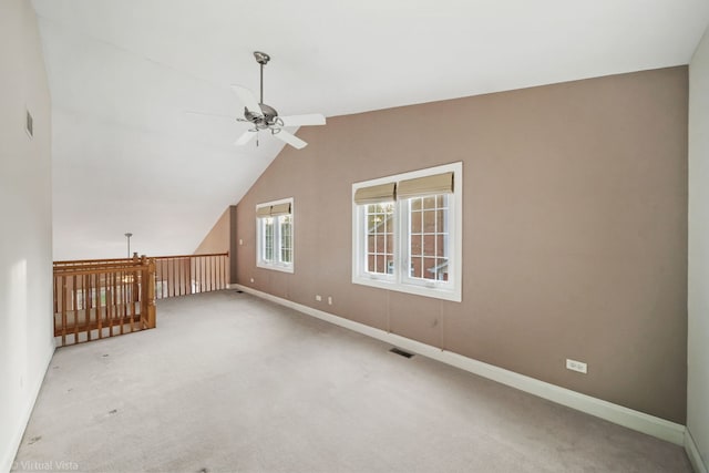 additional living space with carpet flooring, ceiling fan, and lofted ceiling