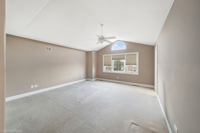 interior space featuring light carpet, ceiling fan, and lofted ceiling