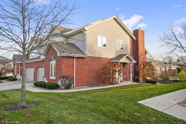 exterior space featuring a garage and a front lawn