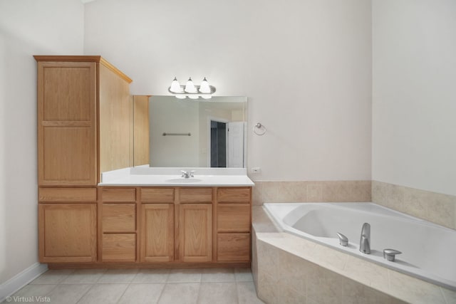 bathroom with vanity, tile patterned flooring, and a relaxing tiled tub