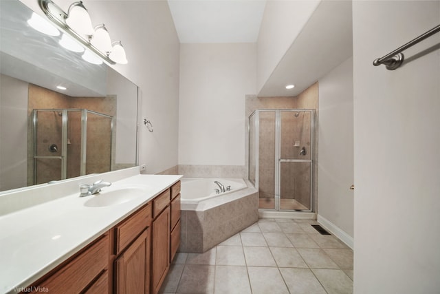 bathroom with tile patterned floors, plus walk in shower, and vanity