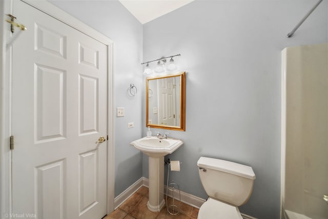 bathroom featuring tile patterned flooring and toilet