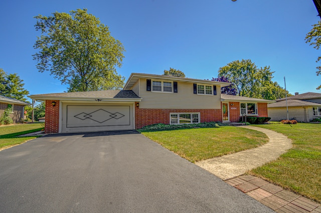 tri-level home with a garage and a front lawn