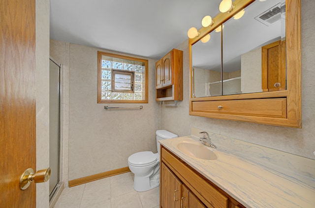 bathroom featuring toilet, tile patterned flooring, vanity, and walk in shower