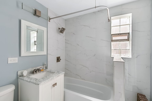 full bathroom featuring radiator heating unit, vanity, tiled shower / bath combo, and toilet