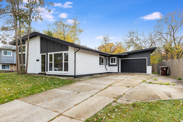 exterior space featuring a lawn and a garage