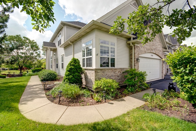 view of side of property featuring a garage