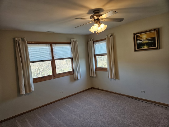 unfurnished room featuring carpet and ceiling fan