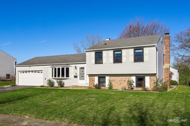 tri-level home featuring a front lawn and a garage