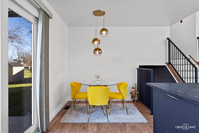 dining room with hardwood / wood-style floors