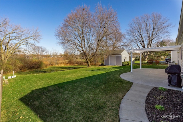 view of yard with an outdoor structure, a patio area, and a pergola