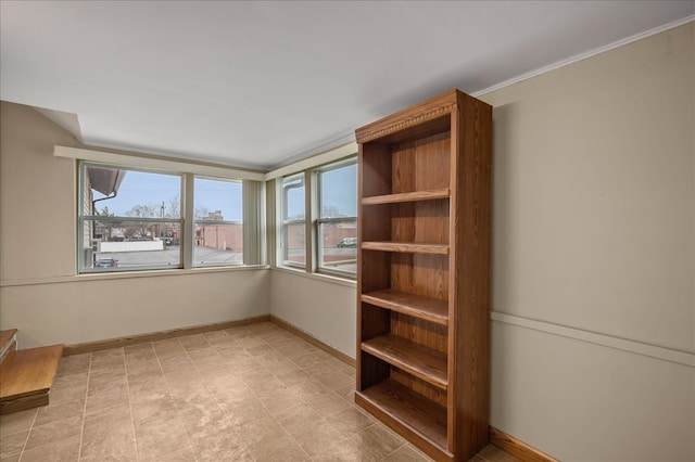 spare room featuring ornamental molding