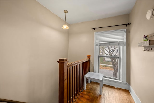 stairs featuring hardwood / wood-style flooring