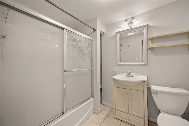 full bathroom with tile patterned flooring, vanity, toilet, and bath / shower combo with glass door