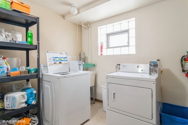 laundry room featuring washer and clothes dryer