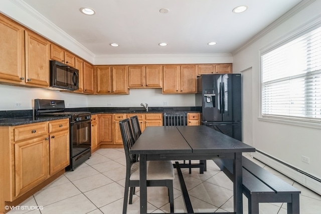 kitchen featuring dark stone counters, ornamental molding, baseboard heating, black appliances, and light tile patterned floors