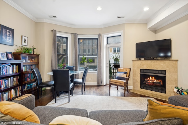 interior space with hardwood / wood-style floors and ornamental molding