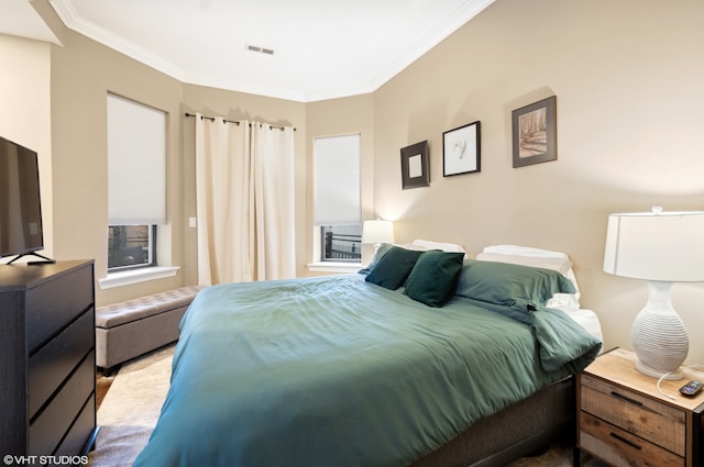 bedroom with crown molding