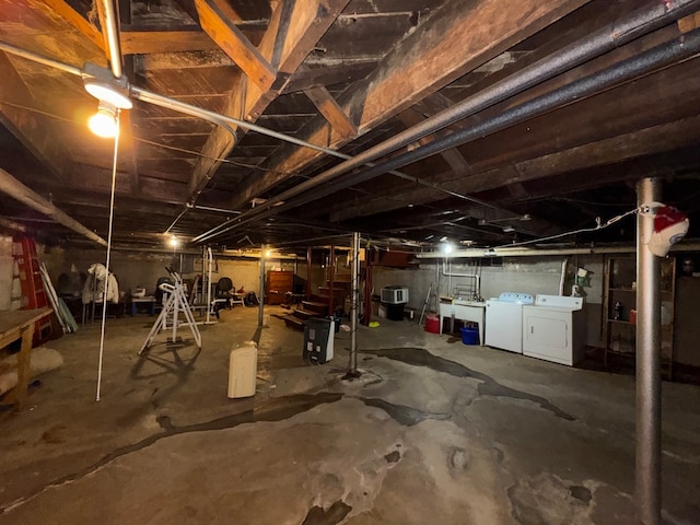 basement with washing machine and clothes dryer