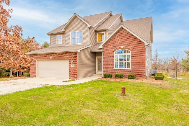 view of property with a front yard and a garage