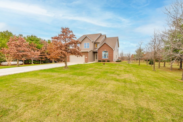 view of front of property featuring a front yard and a garage