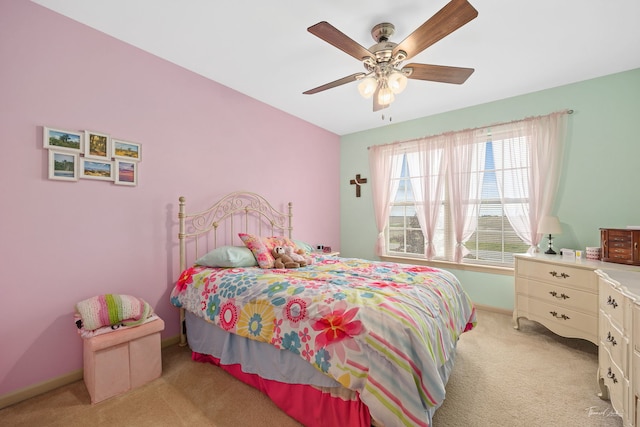 bedroom with ceiling fan and light carpet