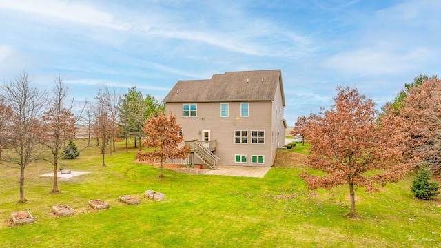 rear view of house featuring a lawn and a wooden deck