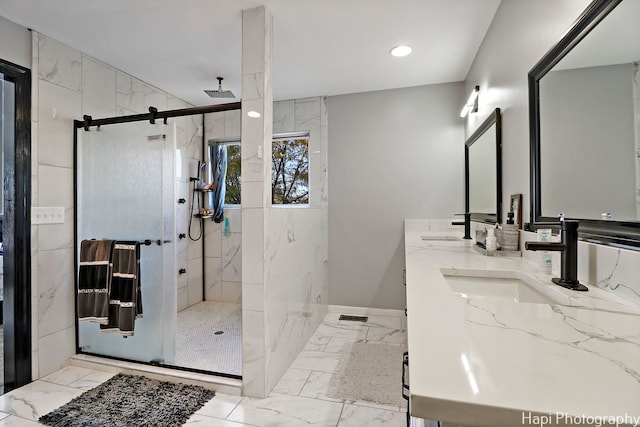 bathroom featuring vanity and tiled shower