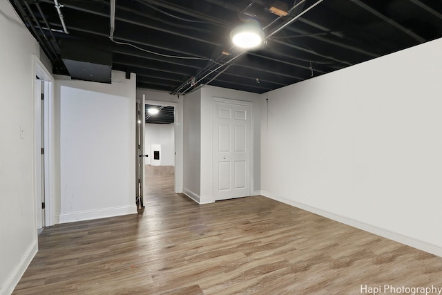 basement featuring wood-type flooring