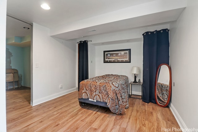 bedroom featuring light hardwood / wood-style flooring