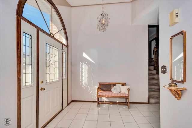 foyer entrance with an inviting chandelier