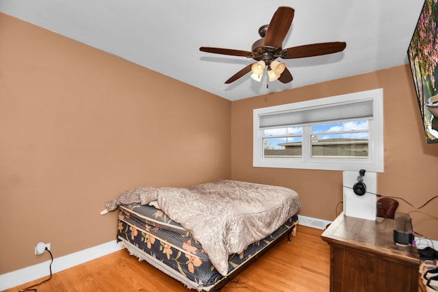 bedroom featuring light hardwood / wood-style flooring and ceiling fan