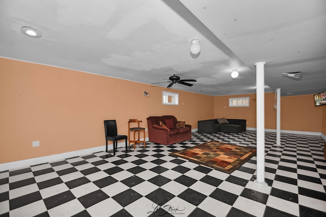 interior space with ceiling fan