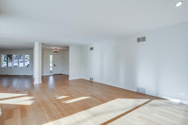 unfurnished living room featuring light hardwood / wood-style floors