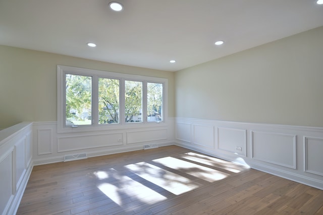 spare room featuring light wood-type flooring