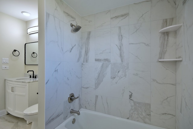 full bathroom featuring vanity, toilet, and tiled shower / bath