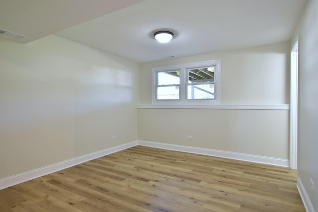 unfurnished room with light hardwood / wood-style flooring