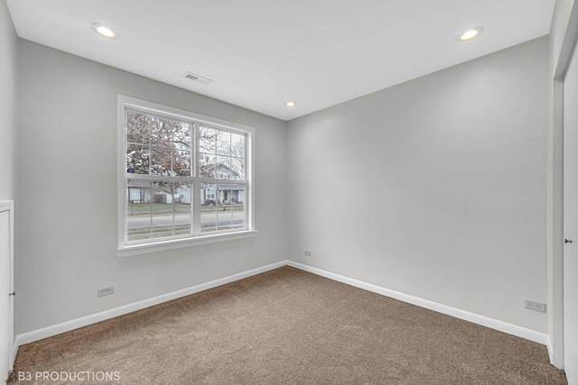 unfurnished room with carpet flooring