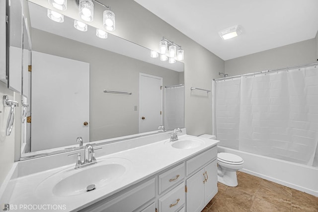 full bathroom with vanity, shower / tub combo, and toilet