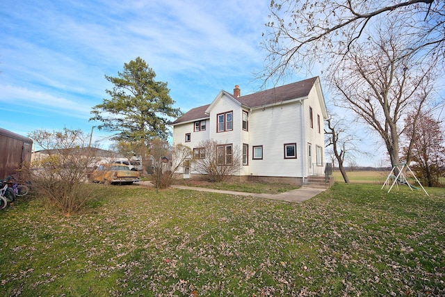 280A W Exchange St, Crete, IL 60417 - view of property exterior featuring a chimney and a lawn