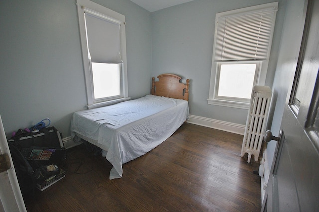 280A W Exchange St, Crete, IL 60417 - bedroom with wood finished floors, baseboards, and radiator heating unit