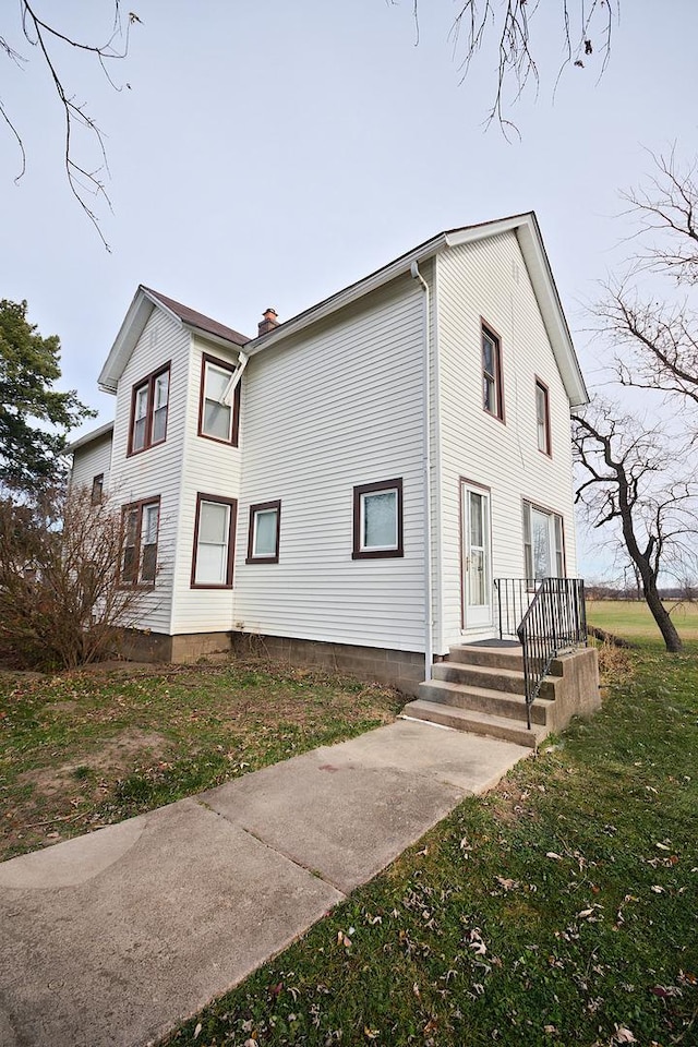 280A W Exchange St, Crete, IL 60417 - view of property exterior featuring a lawn and a chimney