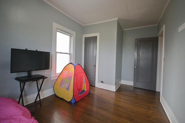 interior space featuring dark hardwood / wood-style floors and crown molding