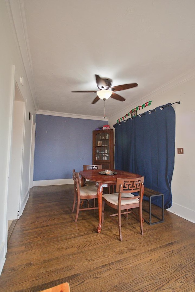 dining area with crown molding, ceiling fan, and dark hardwood / wood-style floors