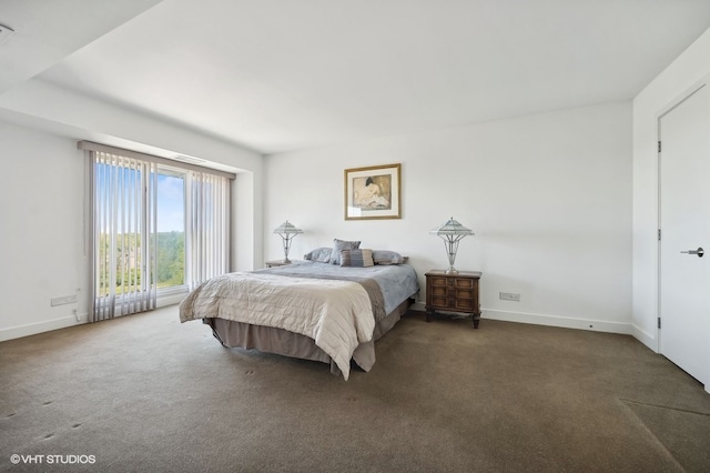 bedroom featuring dark colored carpet