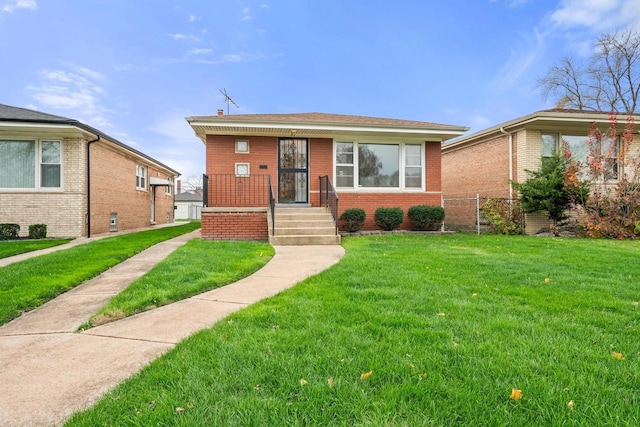 bungalow-style home with a front lawn